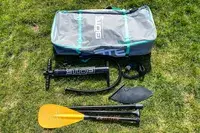 The Bōte WULF Aero Inflatable Paddle Board parts on grass