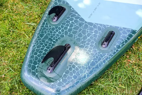 A close-up of the bottom of the iRocker BLACKFIN MODEL Inflatable Paddle Board