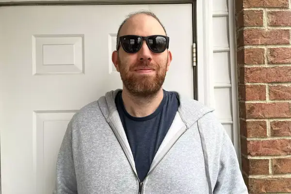 Man wearing Knockaround Premiums Sport Sunglasses standing outside