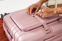 A person holding a strap on the Beis Mini Roller