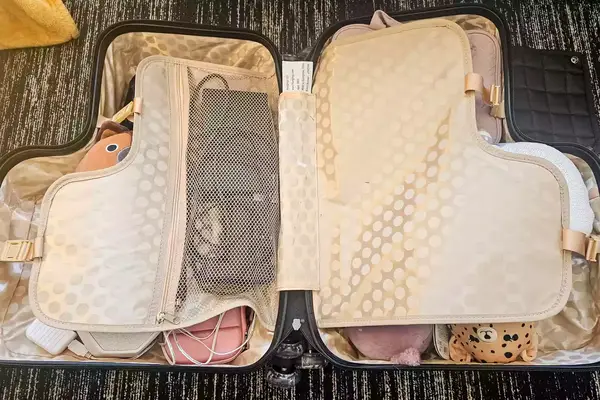 A close-up of a filled Younglingz Ride On Suitcase