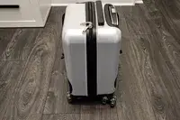 The Younglingz Ride On Suitcase on a wooden floor