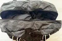 Top-down view of a Paravel Fold-Up Bag with clothing inside