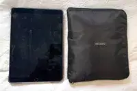 A Paravel Fold-Up Bag folded up next to a tablet