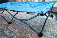A side view of the legs on the Regalo My Cot Deluxe Portable Toddler Bed