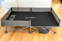 The base of the Baby Delight Go With Me Bungalow Deluxe Portable Travel Cot