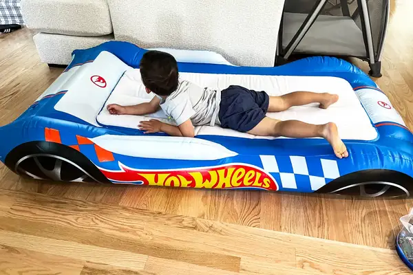 A child lays on the Funboy Kids Sleepover Air Mattress