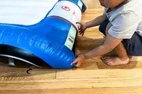 A child adjusts the Funboy Kids Sleepover Air Mattress