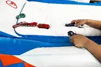 A child plays with toy cars on the Funboy Kids Sleepover Air Mattress