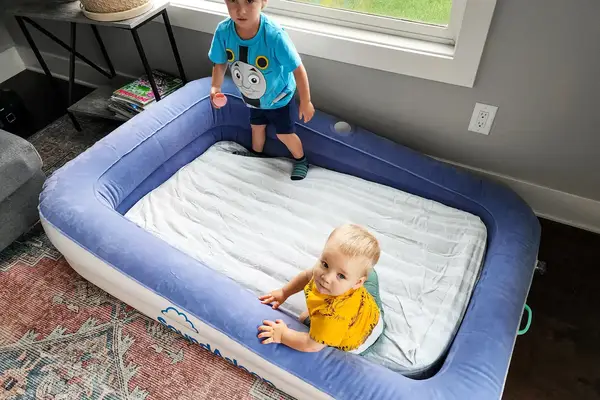 Two children in the SoundAsleep Dream Series Kid Air Mattress