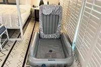 The SlumberPod Slumber Tot Inflatable Toddler Bed with a fitted sheet around the mattress