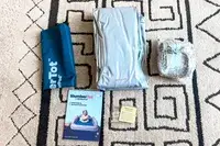 The items included with the SlumberPod Slumber Tot Inflatable Toddler Bed