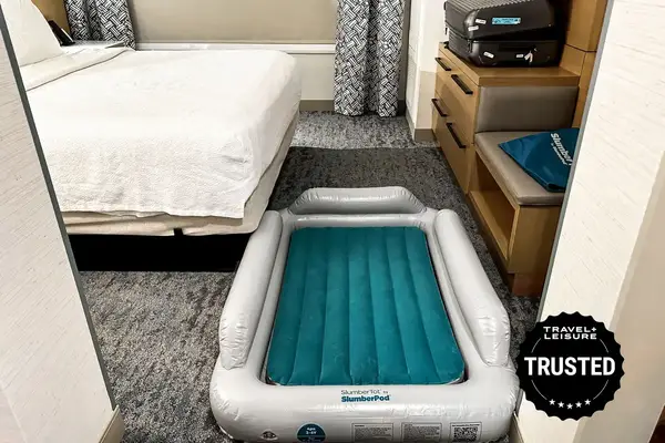 A child lies on the SlumberPod Slumber Tot Inflatable Toddler Bed