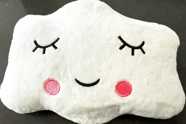 The Sleepah Inflatable Toddler Travel Bed cloud-shaped pillow