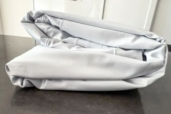 A side view of the folded Sleepah Inflatable Toddler Travel Bed