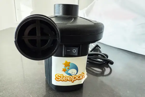 The electric air pump for the Sleepah Inflatable Toddler Travel Bed