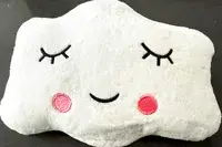 The Sleepah Inflatable Toddler Travel Bed cloud-shaped pillow