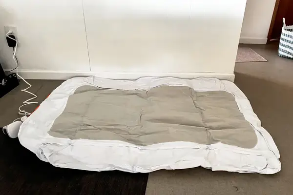 The Regalo Inflatable Toddler Bed is inflated with an electric air pump