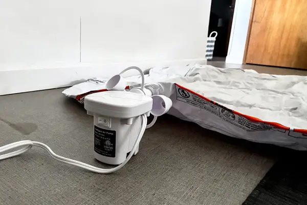 The Regalo Inflatable Toddler Bed is inflated using an electric pump