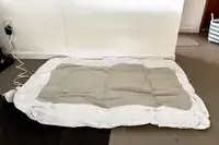 The Regalo Inflatable Toddler Bed is inflated with an electric air pump