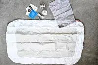 The Regalo Inflatable Toddler Bed and accessories before inflating