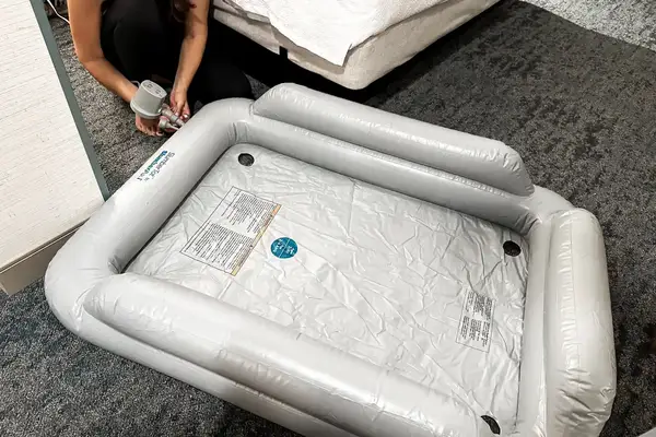 The SlumberPod Slumber Tot Inflatable Toddler Bed is inflated with an electric air pump