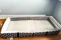 The Milliard Portable Toddler Folding Floor Mat on a wooden floor