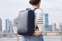 A person wears the XDDesign Bobby Bizz 3-in-1 Anti-Theft Backpack & Briefcase