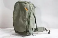 A person attaches a keychain to the Solo NY Stealth Hybrid Backpack