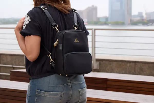 A person wears the Arden Cove Carmel Convertible Backpack and Crossbody like a backpack