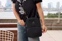 A person unzips the Arden Cove Carmel Convertible Backpack and Crossbody