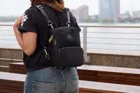 A person wears the Arden Cove Carmel Convertible Backpack and Crossbody like a backpack