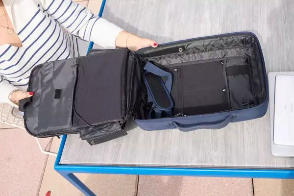 A person opens the XDDesign Bobby Bizz 3-in-1 Anti-Theft Backpack & Briefcase
