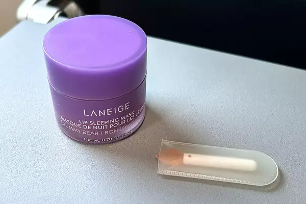 Laniege Sleep Mask bottle and applicator on a tray table
