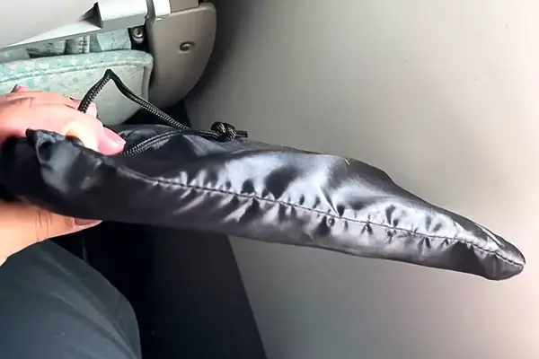 Hand showing the foot rest folded up