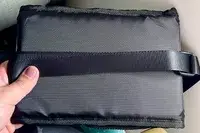 Hold holding a folded up foot rest