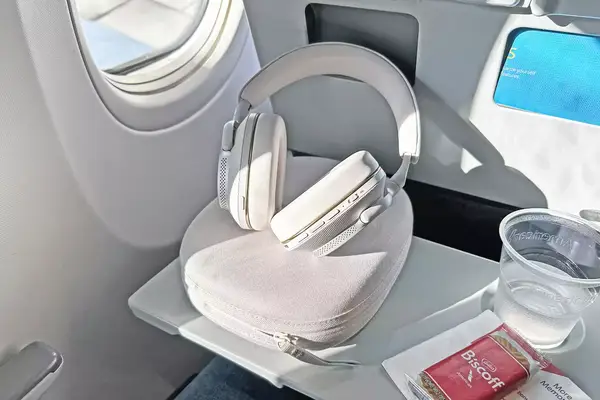 Bowers & Wilkins px6 s2e Headphones on an airplane tray table