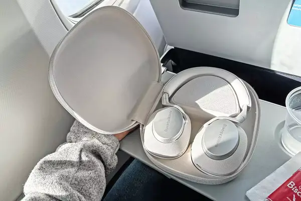 Bowers & Wilkins px6 s2e Headphones on an airplane tray table