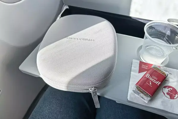 Bowers & Wilkins px6 s2e Headphones on an airplane tray table