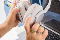 Two hands holding the Bowers & Wilkins Px7 S2e 