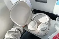Bowers & Wilkins px6 s2e Headphones on an airplane tray table