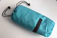 The Bay Laurel Turkish Beach Towel inside of the Travel Bag