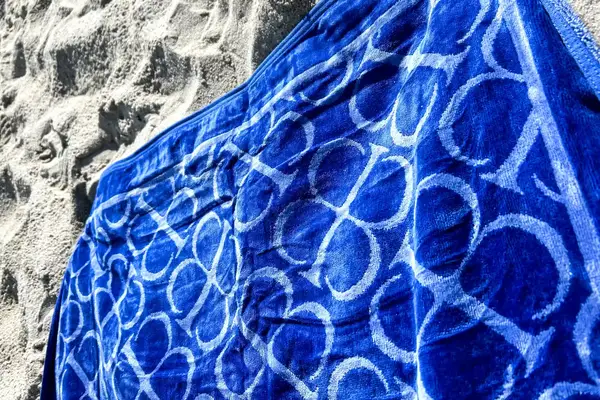 The Boll & Branch The Beach Towel on sand