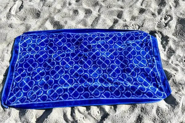 The Boll & Branch The Beach Towel on sand