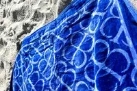 The Boll & Branch The Beach Towel on sand