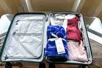 The Boll & Branch The Beach Towel packed in luggage