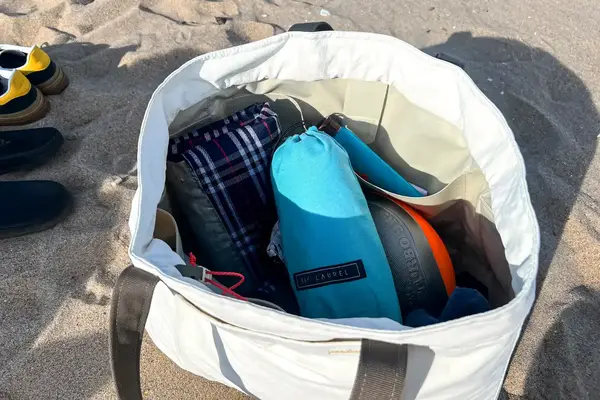 The Bay Laurel Turkish Beach Towel with Travel Bag in a beach bag