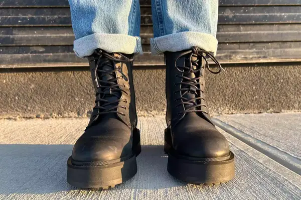 A person wearing the Thursday Boot Co. Quest Boots