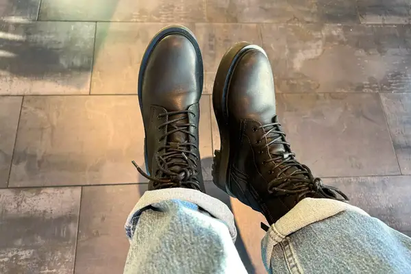 A person wears the Thursday Boot Co. Quest Boots