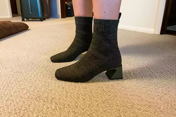 A person wears the Vivaia Regina Pro Square-Toe Water-Repellent Heeled Boots